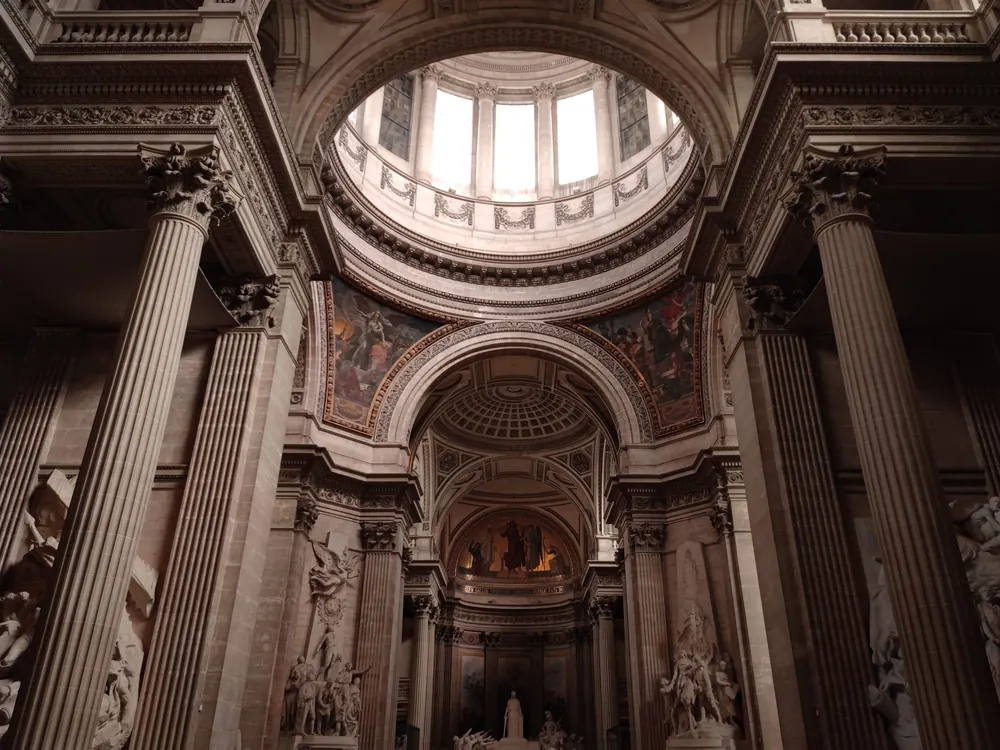 Columns and the painted arches under the dome inside the Panthéon, Paris
