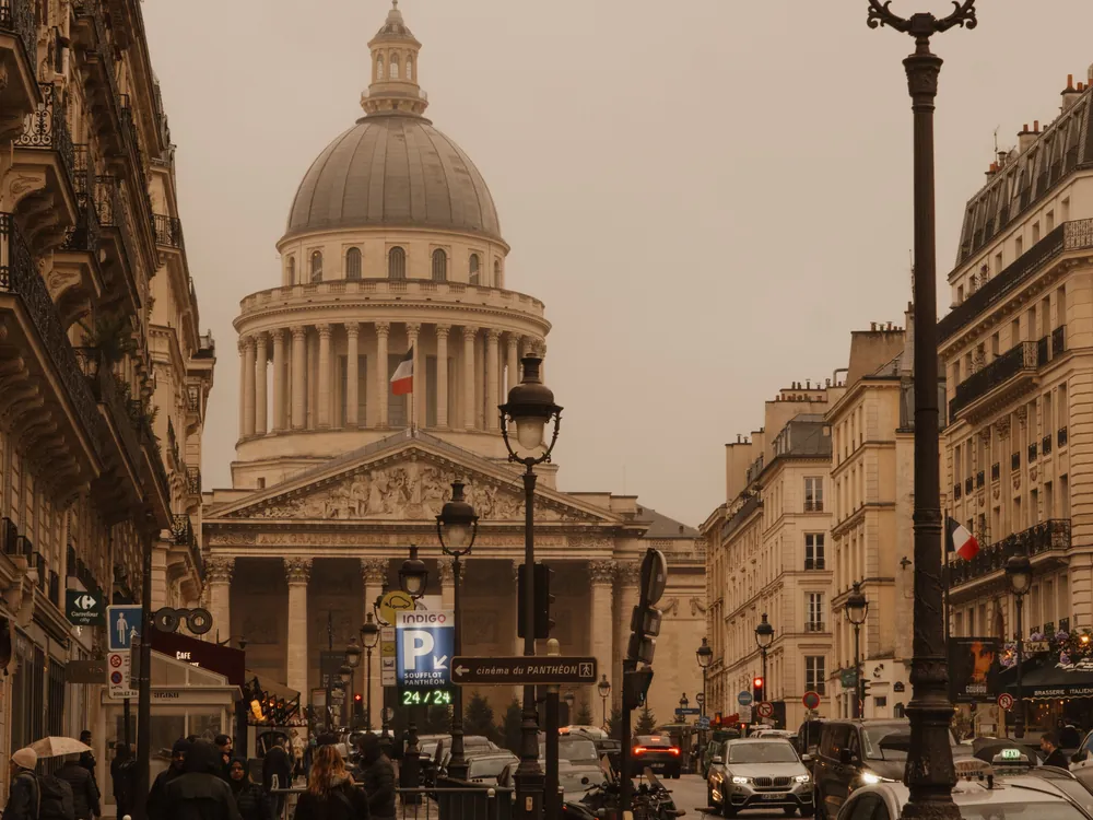 A Paris street climbing toward the Panthéon's dome